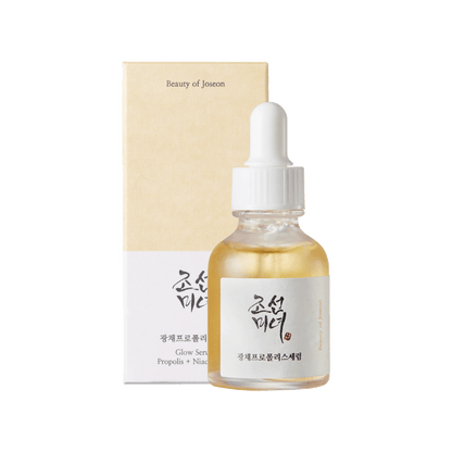 Clear glass dropper bottle with light golden serum and beige box for hydrating glow serum product