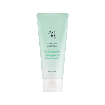 Light green tube of Green Plum Refreshing Cleanser featuring gentle exfoliation for smooth, hydrated skin on white background