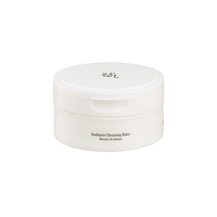 White round jar with subtle label for Radiance Cleansing Balm designed for thorough cleansing on plain background