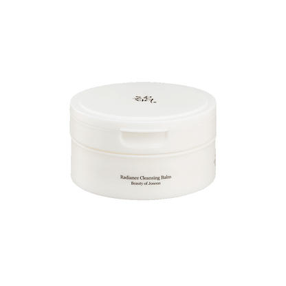 White round jar with subtle label for Radiance Cleansing Balm designed for thorough cleansing on plain background