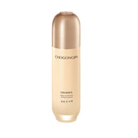 Tall beige and gold bottle of nourishing toner supporting moisture retention on white background