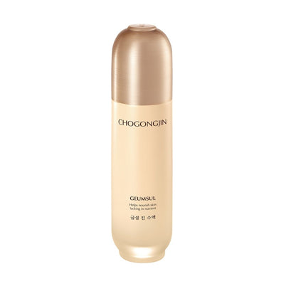 Tall beige and gold bottle of nourishing toner supporting moisture retention on white background