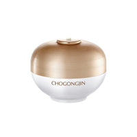 Round white cream jar with a brushed golden lid labeled CHOGONGJIN for dark spot reduction skincare use