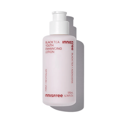 Frosted bottle of youth enhancing lotion with red text highlighting firmness and revitalizing skin resilience benefits