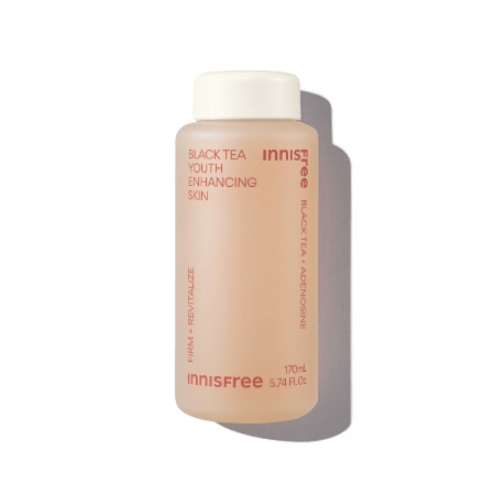 Matte frosted bottle of black tea youth enhancing skin product emphasizing firmness and revitalization benefits