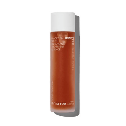 Tall frosted brown bottle with white cap containing youth enhancing essence for skin moisturization on white background