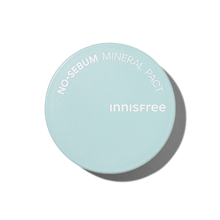 Light blue compact powder case with white text highlighting oil control benefits on a clean white background