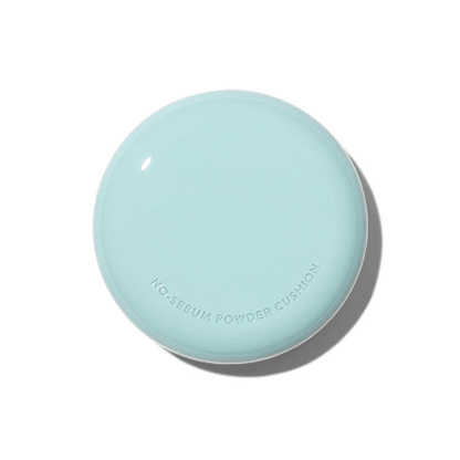 Light blue compact cushion case with smooth matte finish and subtle embossed product name on top surface