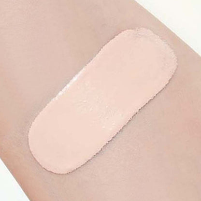 Swatch of smooth, light beige powder cushion applied on skin showcasing soft matte coverage effect