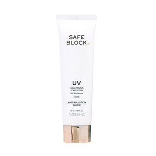 White tube of brightening sun protection cream with SPF50+ and anti-pollution shield on a clean white background