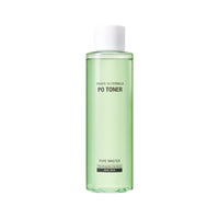 Tall green transparent bottle of pore care toner with white cap and minimalist black text on white background