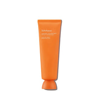 Orange tube of moisturizing overnight mask promoting skin moisture barrier on clean white background