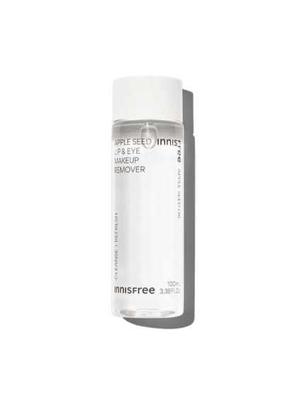 Clear bottle of gentle lip and eye makeup remover with white cap and minimal black text on white background