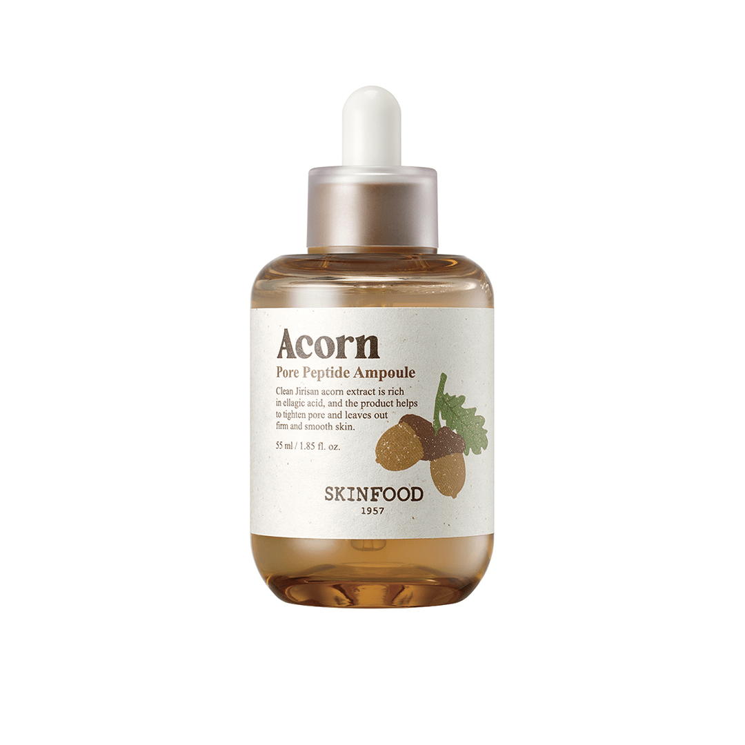 Amber-toned dropper bottle of peptide-enriched pore care serum featuring acorn illustration on minimalist label