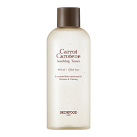 Clear toner bottle with fine carrot seed oil particles inside for hydration and soothing skin care benefits