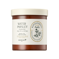 Brown jar of soothing facial pads featuring water parsley extract with minimalist white and beige label design