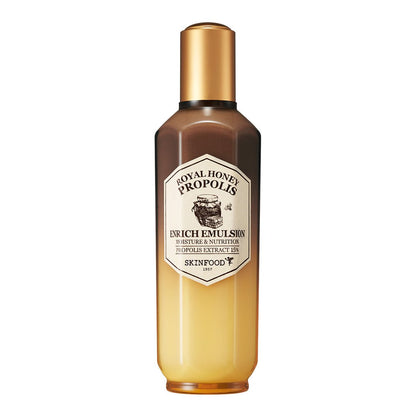 Tall gradient amber and gold bottle of nourishing emulsion with propolis extract for deep hydration on white background