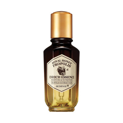 Amber gradient glass bottle of nourishing essence with gold cap highlighting propolis extract for deep hydration benefits