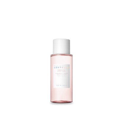 Clear pale pink toner bottle with white cap and minimalist label for pore minimizing skincare on white background