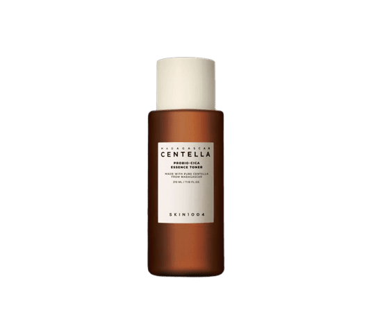 Brown bottle of calming essence toner with white label and cream-colored cap for soothing skin care use