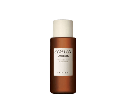 Brown bottle of calming essence toner with white label and cream-colored cap for soothing skin care use