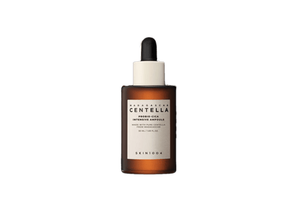 Brown glass dropper bottle with white label for hydrating skincare ampoule on a white background