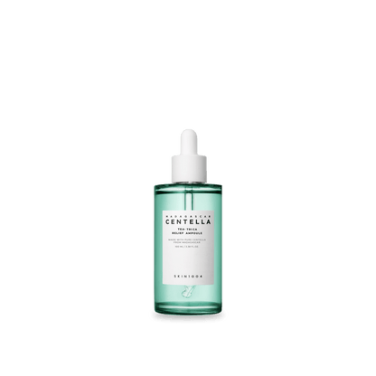 Clear green glass dropper bottle containing calming tea tree relief ampoule serum on white background
