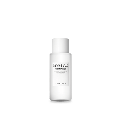 Minimalist white cylindrical skincare toner bottle with black text highlighting hydration and brightening benefits on white background