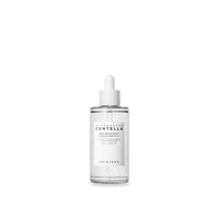 Clear glass dropper bottle of brightening ampoule with visible serum capsules and white label on white background