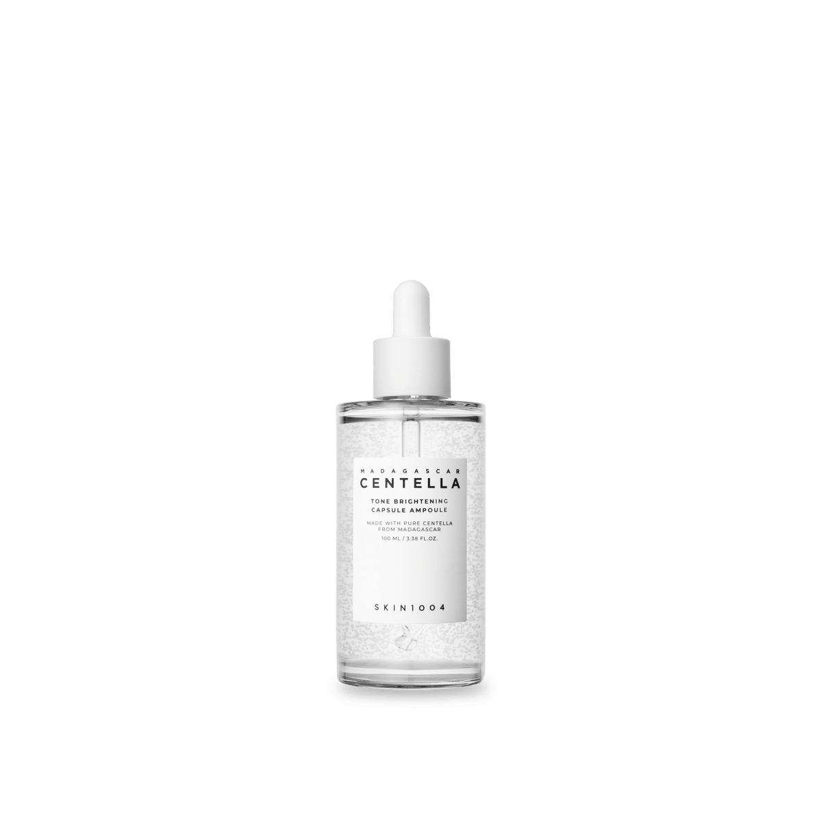 Clear glass dropper bottle of brightening ampoule with visible serum capsules and white label on white background