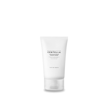 White tube of hydrating tone brightening capsule cream with minimalist black text on translucent cap