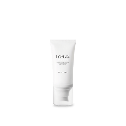 White tube of tone brightening sunscreen with broad-spectrum protection on plain background