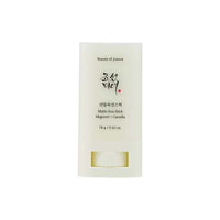 Minimalist white matte sun stick container with black and red Korean script and product details on front