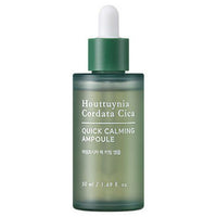 Frosted green glass dropper bottle of quick calming ampoule with moisturizing benefits against white background