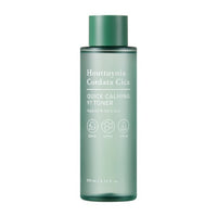 Green translucent toner bottle labeled for quick calming and deep moisture benefits in minimalist design