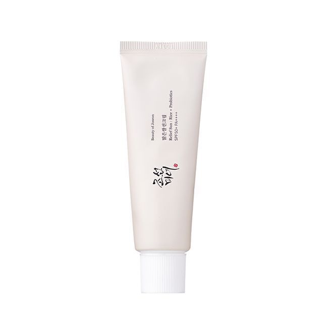 Minimalist white tube of sun protection cream with black text highlighting SPF50+ and probiotic benefits on white background