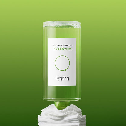 beplain Mung Bean Cleansing Water 400ml bottle inverted dispensing clear cleansing water onto cotton pads on green background