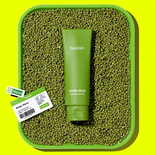 beplain Mung Bean Milk Peeling Gel 120ml tube on tray of mung beans emphasizing gentle exfoliation and vegan formula