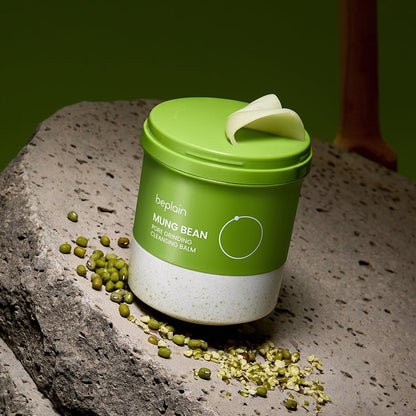 beplain Mung Bean Pore Grinding Cleansing Balm 100ml in green and white jar with mung beans on stone surface for effective cleansing