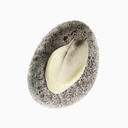 beplain Mung Bean Pore Grinding Cleansing Balm 100ml swatched cream texture on smooth gray stone background