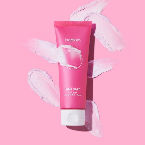 beplain Pink Salt AHA BHA Cleansing Foam 120ml tube with creamy foam texture on soft pink background for exfoliation care