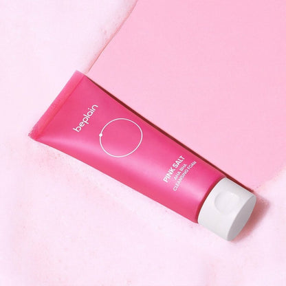 beplain Pink Salt AHA BHA Cleansing Foam 120ml in pink tube with white cap on soft foamy surface for exfoliation care