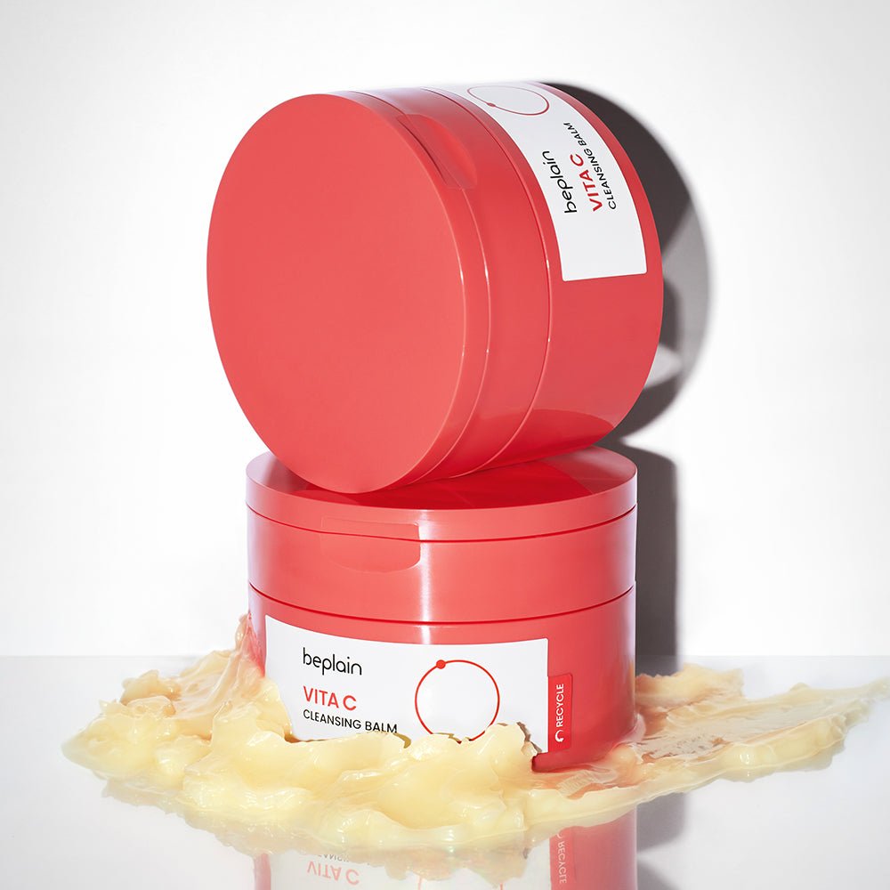 beplain Vita C Cleansing Balm 100ml in bright orange jar with smooth balm texture on reflective white surface