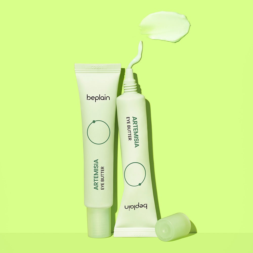 beplain Artemisia Eye Butter 25ml tubes with soft green cream swatch on bright lime background for deep hydration