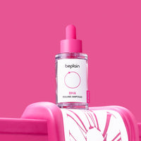 beplain BHA Peeling Ampoule 30ml bottle with pink dropper on vibrant pink background highlighting exfoliation benefits