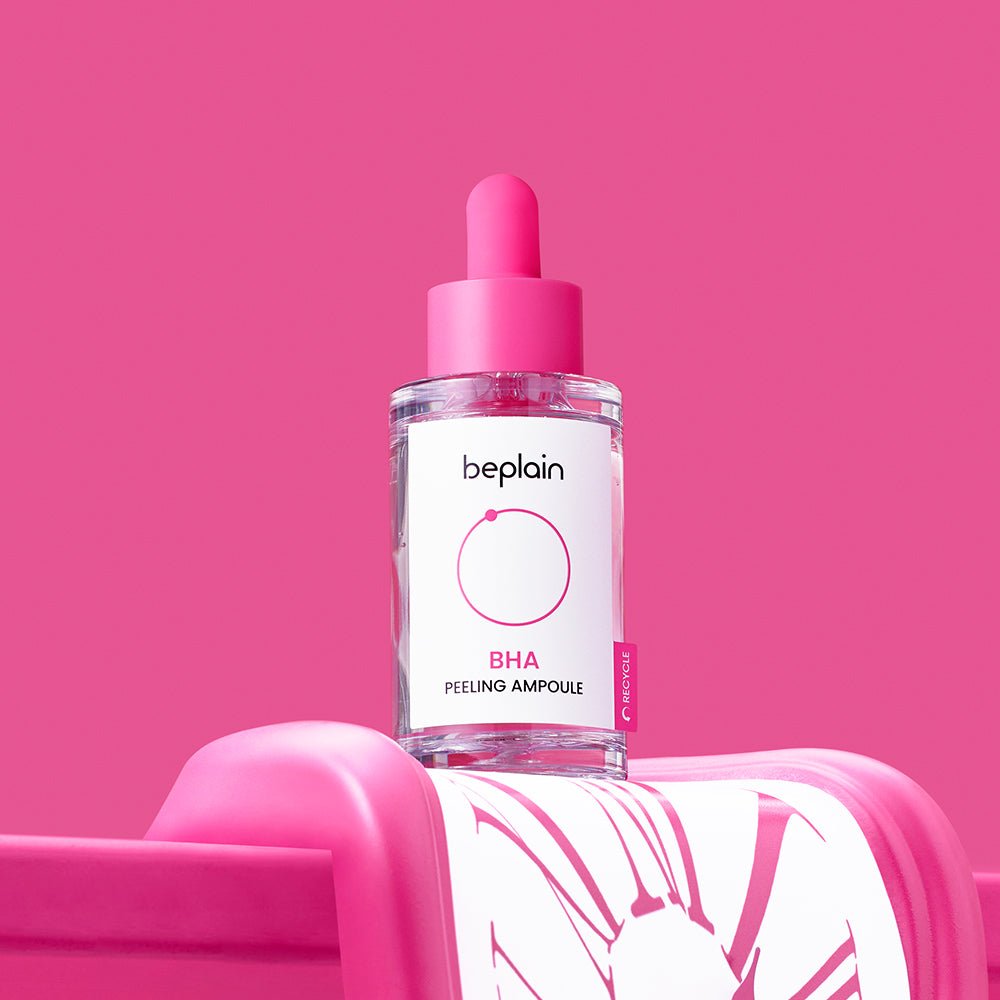 beplain BHA Peeling Ampoule 30ml bottle with pink dropper on vibrant pink background highlighting exfoliation benefits