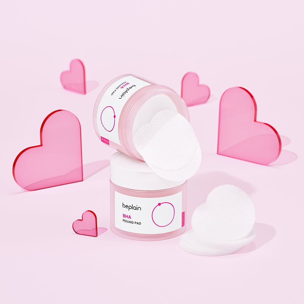 beplain BHA Peeling Pad 50P in white containers with gentle exfoliation pads surrounded by pink heart decorations