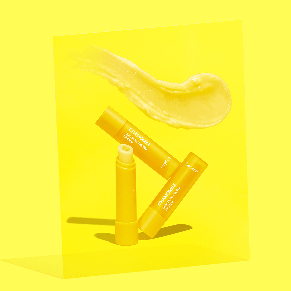 beplain Chamomile Dual Moisturizing Lip Balm 3.6g in yellow tubes with creamy lip balm texture on bright yellow background