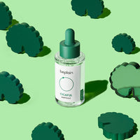 beplain Cicaful Ampoule 30ml dropper bottle with soothing relief serum on green background with decorative shapes