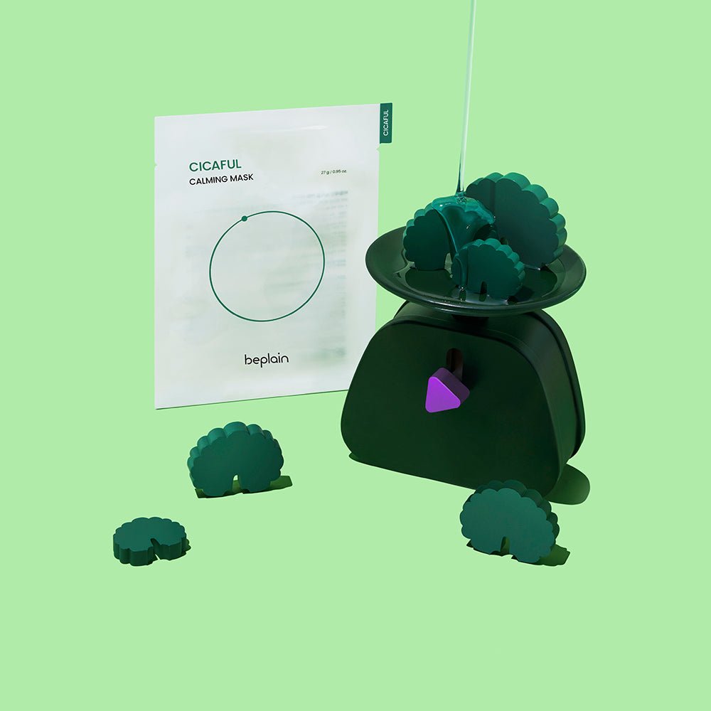 beplain Cicaful Calming Mask 10P packaging displayed beside green decorative items on a pastel green background